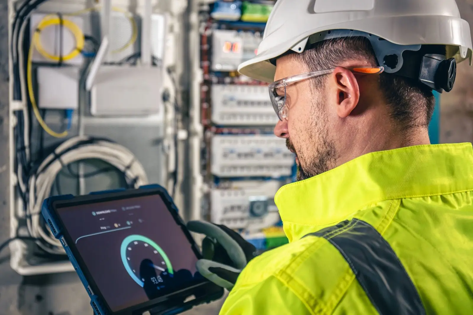 FibrePros technician checking a connection on a tablet